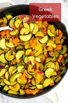 a pan filled with cooked vegetables on top of a table