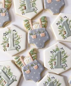 decorated cookies are arranged in the shape of letters