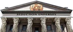 the front entrance to seduction university with statues on either side and an emblem above it