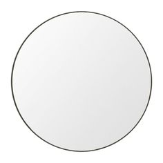 a white round mirror on a white background