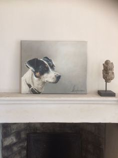 a dog is sitting in front of a painting