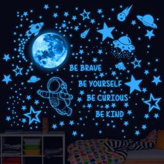 the glow in the dark wall sticker is designed to look like an outer space theme