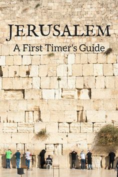 people are standing in front of the western wall