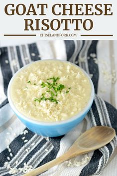 a bowl of cheese risotto on top of a blue and white towel with a wooden spoon