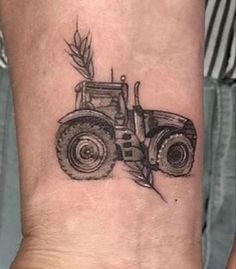 a black and white photo of a tractor on the ankle