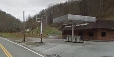 an empty parking lot next to a road