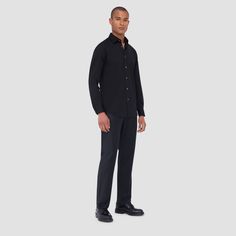 The James solid OoohCotton shirt features a point collar, adjustable notched cuffs, mother-of-pearl buttons, and a curved hem perfect for wearing tucked or untucked. OoohCotton is a performance, double-mercerized, wrinkle-resistant, breathable, and easy-care cotton blend with 8-way stretch, quick-dry, and thermal comfort properties. Black Formal Top With Spread Collar, Formal Black Top With Spread Collar, Tailored Collared Top For Formal Occasions, Formal Solid Shirt With Button Cuffs, Formal Black Shirt With Concealed Placket, Black Relaxed Fit Formal Shirt, Formal Black Relaxed Fit Shirt, Black Relaxed Fit Formal Top, Formal Black Tops With Button Cuffs