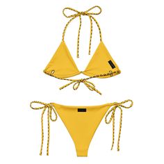 Make a stylish statement with the Black Yellow WQ Monogram String Bikini from Wrap Queen. This two-piece swimsuit combines a sleek black design with vibrant yellow accents and features the iconic WQ monogram. With adjustable string ties for a personalized fit, this bikini offers both comfort and confidence. It’s made from soft recycled polyester with double-layering and UPF 50+ to protect your skin. The bikini top comes with removable padding for added comfort, and the soft and stretchy material Gold Tie-side Bottom Swimwear For Swimming, Yellow Drawstring Swimwear For Summer, Adjustable Yellow Swimwear For The Pool, Yellow Fitted Swimwear With Drawstring, Fitted Yellow Swimwear With Drawstring, Yellow Accents, Quality Fashion, Black Design, Head Wraps