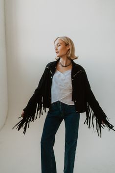 Black is a staple color and the fringe detail is all we've ever wanted and more! Suede Eyelet detail Fringe jacket 90% polyester 10% spandex Model is 5'1" and wearing a size small. The length of a size small measures 20.5". Small: 2-4 Medium: 6-8 Large: 10-12 Short Fringe Jacket, Long Sleeve Outerwear With Beaded Fringe For Spring, Beaded Fringe Long Sleeve Outerwear For Spring, Trendy Beaded Fringe Fall Outerwear, Spring Black Tasseled Outerwear, Black Winter Outerwear With Tassels, Black Tasseled Outerwear For Winter, Fitted Winter Outerwear With Frayed Hem, Black Outerwear With Frayed Hem For Fall