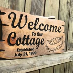 a wooden sign that says welcome to our cottage