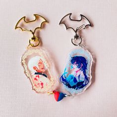 "2\" charms of Vanitas and Noé from The Case Study of Vanitas. They each have half of a magnetic heart accessory that attaches to each other." Goofy Photos, Shaker Keychain, The Case Study Of Vanitas, Case Study Of Vanitas, Magical Accessories, Buying Stuff, Heart Accessories, Merch Ideas, Horror Movie Characters