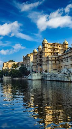 a large building sitting on top of a lake