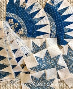 several pieces of blue and white quilted fabric