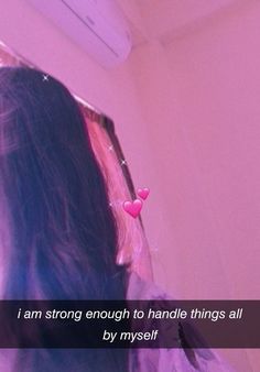 a girl looking at her reflection in a mirror with the caption i am strong enough to handle things all by my self