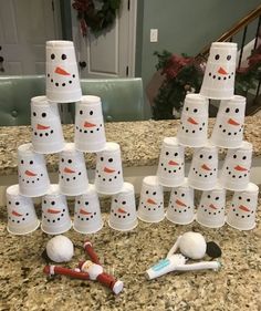 there are many cups that have been made to look like snowmen and toothbrushes