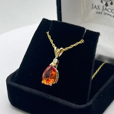 Beautiful Padparadscha and Diamond Pendant Necklace * 2.5ct Pear Cut Orange Padparadscha Sapphire measures 10x7mm * Brilliant Cut Diamond measures 2.2mm Round (G-H SI1) * 14k Yellow Gold * 16" or 18 inch Chain included - Select your Length Hallmarked & Gift Ready! This Sapphire is laboratory grown.  It is identical to the natural stone in every way including chemistry, composition & hardness.   TIMELESS, BEAUTIFUL & UNIQUE FINE ART JEWELRY Luxury Vintage Orange Necklace, Luxury Orange Pendant Necklace, Unique Luxury Orange Necklaces, Orange Pear-shaped Jewelry, Orange Teardrop Jewelry For Formal Occasions, Pear-shaped Yellow Gold Gemstones For Gifts, Pear-shaped Orange Jewelry Gift, Orange Teardrop Anniversary Jewelry, Orange Pear-shaped Jewelry For Gifts