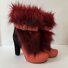 Vintage Red Pearl - MC Chunky Faux Fur High Heel Short Booties Size 38 Made in Turkey Sleek style is yours when you slip into these unique Zeyzani chunky heel boots!  This is what they mean when they say boots with the fur! So fun and so unique. Genuine Suede & Genuine Leather Upper Faux fur details upper Lined with breathe-easy genuine leather Round toe Full length zipper closure with buckle accent ¾" platform, 4" chunky heel wrapped with genuine suede Please view pictures as part of the descri Red High Heel Platform Boots For Winter, Red High Heel Winter Booties, Red High Heel Booties For Winter, Bold Winter Heeled Boots With Round Toe, Red Round Toe Booties For Winter, Winter Boots With Red Sole And Block Heel, Red Leather Heels For Winter, Red Winter Ankle Booties, Red Ankle Booties For Winter