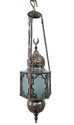 an old fashioned hanging lantern with chain attached to it