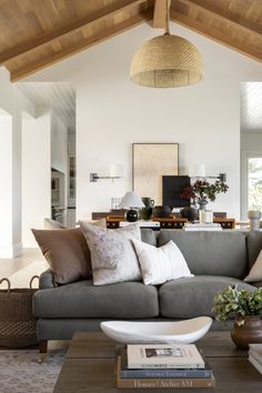 a living room filled with lots of furniture and decor on top of a wooden table