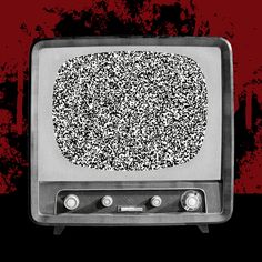 an old fashioned television with black and white designs on it's screen, sitting in front of a red background