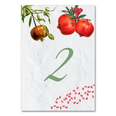 the number two is made up of tomatoes and pomegranates on paper