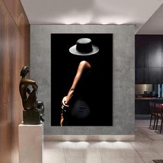 a woman with a hat on her head is standing in the middle of a room