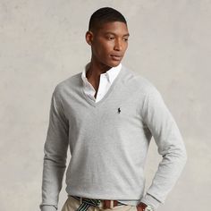 This V-neck sweater is finely knit from soft cotton and finished with our signature embroidered Pony. V-neck Polo Sweater For Work, Classic Fitted V-neck Polo Sweater, Classic V-neck Sweater With Ribbed Cuffs, Elegant Cotton V-neck Cardigan, Classic Fine Knit Polo Sweater For Spring, Fitted Knit V-neck Polo Sweater, Fitted V-neck Polo Sweater, Casual, Casual Fitted V-neck Polo Sweater, Fitted V-neck Knit Polo Sweater