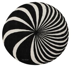 a black and white circular rug with an abstract design in the shape of a spiral