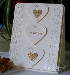 a card with two hearts on it and the words mr and mrs written in gold