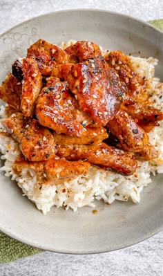 a white plate topped with chicken and rice