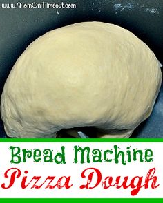 bread machine pizza dough in a pan with the words bread machine pizza dough