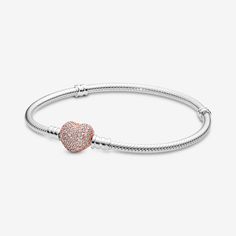 Put some love in your look with our classic Pandora Moments Pavé Heart Clasp Snake Chain Bracelet that's been given a romantic update with a heart-shaped, 14k rose gold-plated clasp. The pretty heart is detailed with cubic zirconia for a sparkling finish. The sterling silver style transitions effortlessly from day to night – and we think it looks equally elegant worn with or without charms, solo or stacked. Wear it to show more of the things you love. - Pandora Moments Pavé Heart Clasp Snake Chain Bracelet - Sterling silver and 14k Rose gold-plated unique metal blend / Cubic Zirconia / Clear - Sz. 9.1 in Bead Snake, Pretty Heart, Bracelet Pandora, Snake Chain Bracelets, Mesh Bracelet, Jewellery Uk, Bracelet Collection, Pandora Bracelet, Snake Chain