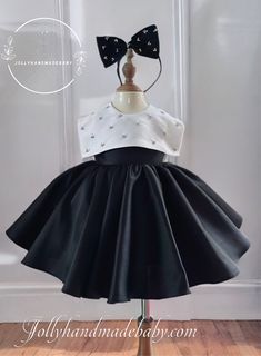 Elevate your little girl's wardrobe with our exquisite Jollyhandmade black satin dress adorned with pearls. This luxurious dress is designed and handmade with meticulous attention to detail, featuring fluffy ruffles that add a touch of elegance.  Available in a variety of colors and custom sizes, this dress is not only stylish but also comfortable for your baby's delicate skin. As a bonus, each dress comes with a free matching headband for the perfect finishing touch. Enjoy fast delivery and wor Elegant Baptism Dress With Bow For Party, Elegant Tutu Dress With Bow For Baptism, Elegant Baptism Tutu Dress With Bow, Elegant Fitted Pageant Dress For Birthday, Elegant Fitted Birthday Pageant Dress, Elegant Sleeveless Tutu Dress For Baptism, Elegant Fitted Tutu Dress For Birthday, Elegant Tutu Dress For Dress-up, Elegant Ruffled Pageant Dress For Birthday