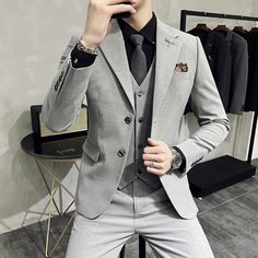 Luxury 3-Piece Men's Suit Set - Wedding & Business Elevate your style with this high-end men's 3-piece suit set, perfect for weddings and business occasions. Crafted by a renowned boutique brand, this solid color ensemble features a jacket, vest, and pants designed to make you stand out. Impeccable tailoring and luxurious fabrics ensure a comfortable and sophisticated look. Upgrade your wardrobe today with this statement piece that combines timeless elegance with modern flair. SPECIFICATIONS Sty Gray Three-piece Suit For Semi-formal Occasions, Slim Fit Wedding Sets, Gray Groom's Suit, Groom's Single Breasted Suiting Fabric Set, Slim Wedding Dresses, Dress Banquet, Groom Wedding Dress, Mens Fashion Business, Jacket Vest