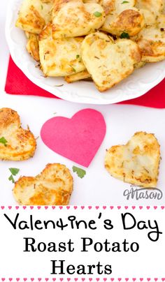 valentine's day roast potato hearts on a white plate with pink heart shaped paper