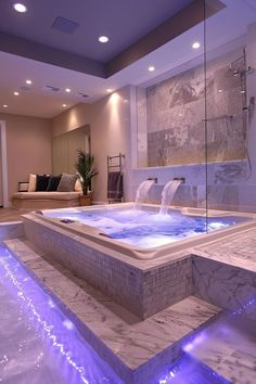 a large jacuzzi tub sitting inside of a bathroom