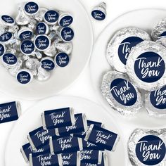 blue and white thank you candy bar wrappers on plates with silver foil wrapped herspoos