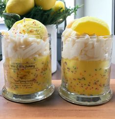 two jars filled with yellow and white desserts