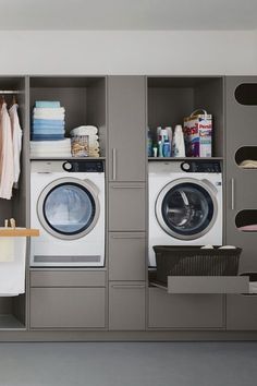 a washer and dryer sitting in a room next to each other on shelves