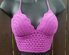 a mannequin wearing a purple crochet bra