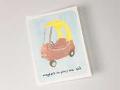 a card with an image of a car on the front and yellow umbrella in the back