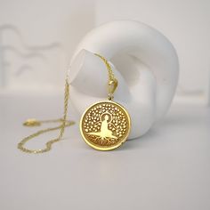 This stunning Tree of Life Buddha Necklace is a beautiful and meaningful piece that exudes peace and tranquility. The intricate design features a delicate tree of life charm with a serene Buddha at its center. Crafted with high quality materials, this necklace is perfect for adding a touch of spirituality to your everyday style. Wear it as a reminder to stay grounded and connected to nature's beauty. This unique necklace also makes a thoughtful gift for spiritual seekers and nature lovers alike. Spiritual Tree Of Life Necklace For Meditation, Faberge Jewelry, Buddha Necklace, Stay Grounded, Buddha Pendant, Yoga Accessories, Elegant Pendant, Unique Necklace, Spiritual Jewelry