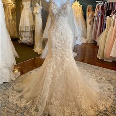 a wedding dress on display in a bridal shop