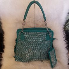 Handbag Express Turquoise Bling Rhinestone Tote Covered In Sparkling Rhinestones The Front Of This Shoulder Bag Is A Shining Example Of A Chic Sophistication Has A Back Zippered Pocket 8 Inch Drop Length Double Straps And 22 Inch Drop Length Detachable Strap. Made Of Faux Leather And Fully Lined Interior. Has Two Interior Slip Pockets And One Zippered Pocket Top Zipper Closure Silver Hardware Tablet Compatible Evening Green Shoulder Bag With Silver-tone Hardware, Green Top Handle Shoulder Bag With Silver-tone Hardware, Gucci Gg Bag, Green Satchel Bag With Silver-tone Hardware, Green Rectangular Shoulder Bag With Silver-tone Hardware, Modern Green Shoulder Bag With Silver-tone Hardware, Small Canvas Bags, Tory Burch Kira Chevron, Seatbelt Bags