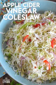 a bowl filled with coleslaw on top of a table