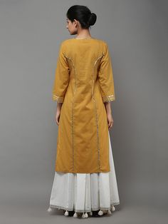 Description: A beautiful tie neck kurta with tassels. It has gota detailing on neck, placket, tassels, princess seams in front & back and sleeves. The lengt Plain Kurta, डिजाइनर कपड़े, Simple Kurti Designs, Kurti Embroidery Design, Gota Work