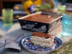 a piece of cake sitting on top of a blue and white plate