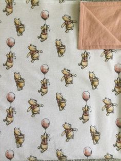 a blanket with winnie the pooh on it