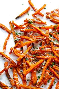 a pile of cooked carrots with parmesan cheese