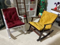 two rocking chairs in front of a christmas tree